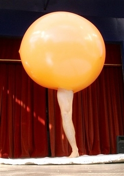 Lars Lottrup stands with only his leg protruding from a balloon Thursday Aug. 10, 2006 at the International Clown Festival in Copenhagen, Denmark. Clowns from a number of countries around the world have convened in Denmark for the festival. 
