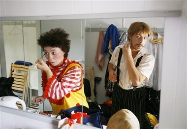 Russian clowns from Moscow Galina and Yuri Emeliyanovs apply makeup while preparing for a show in Copenhagen, Denmark Wednesday Aug. 9, 2006. Clowns from Italy, Belgium, Denmark, Spain and Russia among other places are gathering for the 11th International Clown Festival in Denmark held Aug. 10-20 at the Bakken amusement park 20 kilometers (13 miles) north of Copenhagen. 