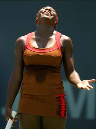 Serena Williams of the U.S. reacts during her win over compatriot Meghann Shaughnessy at the JPMorgan Chase Open women's tennis tournament in Carson, California August 11, 2006. 