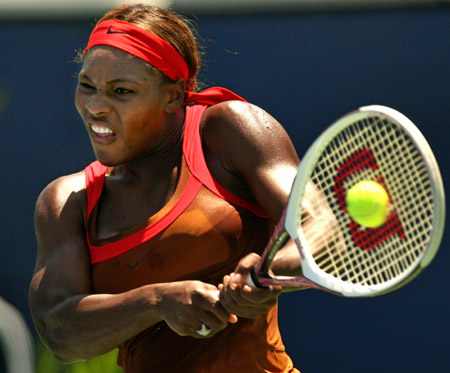 Serena Williams of the U.S. hits a backhand to compatriot Meghann Shaughnessy during her win at the JPMorgan Chase Open women's tennis tournament in Carson, California August 11, 2006. 