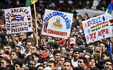 Cuban, Venezuelan and Bolivian medical students hold placards hailing Cuban President Fidel Castro during a concert commemorating his 80th birthday at the Anti-imperialist Square in Havana. 