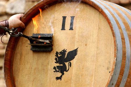 A date stamp is marked on a wine barrel before a wine barrel race in Montepulciano, near Siena, central Italy, September 3, 2006. The race, known as the Il Bravio delle Botti, is the highlight of a 10-day holiday dating back to the 14th century to celebrate Montepulciano's patron Saint John the Baptist, with costumed ceremonies, dance parties, street theatre performances and lavish parties served on the squares. Picture taken September 3, 2006. 