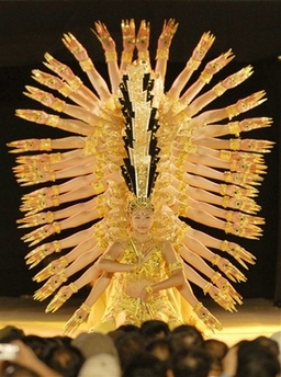 Members of the Chinese Disabled Persons' Art Performing Troupe perform their best know work 'Bodhisattva with 1,000 hands' dance to celebrate the first anniversary of Aichi Expo opening in Nagoya, central Japan Monday night, Sept. 25, 2006.