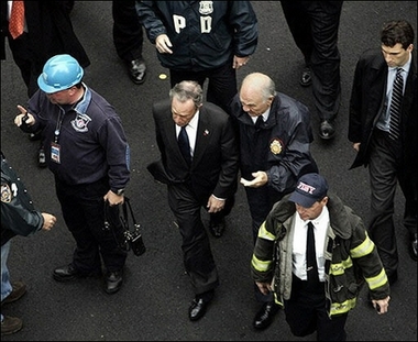 New York City Mayor Michael Bloomberg(C-L) and New York City Fire Commissioner Nicholas Scoppetta (C-R) arrive at the scene of a small plane crash into an apartment building on the east side of Manhattan. A small aircraft piloted by US baseball player, Cory Lidle of the NY Yankees, crashed into a high-rise apartment building in Manhattan, killing two people and triggering memories of the September 11 attacks of five years ago.