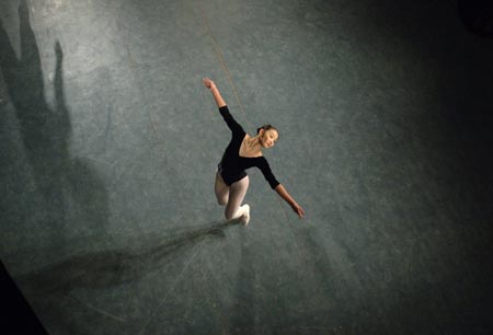 A student from a local arts institute puts on a performance for talent scouts during a graduation show in Hefei in east China's Anhui province December 19, 2006. 