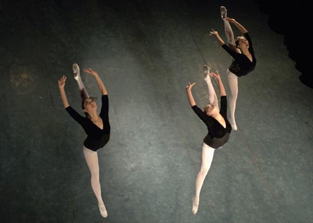 Students from a local arts institute put on a performance for talent scouts during a graduation show in Hefei in east China's Anhui province December 19, 2006.