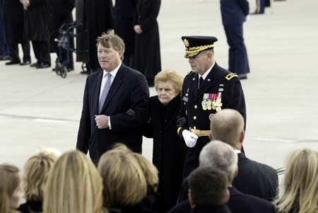 Betty Ford (C), widow of former President Gerald R. Ford, is escorted by Jack Ford (L) and U.S. Army Major General Guy Swan at Gerald R. Ford International Airport in Grand Rapids, Michigan January 2, 2007.
