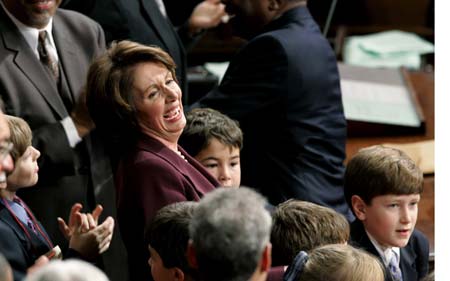 U.S. Speaker of the House Nancy Pelosi (D-Ca) reacts as she stands with her grandchildren on the House floor as the vote is announced electing her the first ever female Speaker of the U.S. House of Representatives on the first day of the 110th Congress in Washington January 4, 2007.