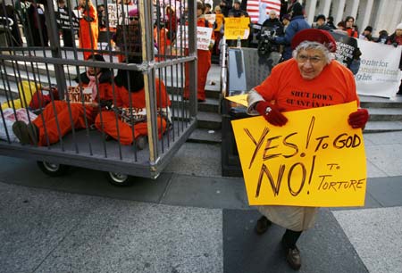 Sister Cecilia Palange holds a sign during the International Day to Shut Down Guantanamo protest, in New York January 11, 2007. Anti-war and human rights groups demonstrated in Manhattan and around the country to close the US-run prison in Guantanamo Bay on the fifth anniversary since the U.S. first transferred men to the prison. 