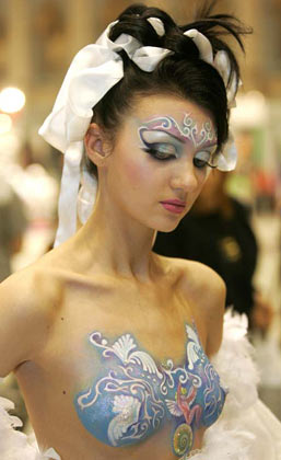 A model gets ready for the Tenth Moscow Championship of Hairdressers and Nail Art Designers in central Moscow, January 26, 2007. Over 300 artists are competing in the show, till the finals on Saturday. 