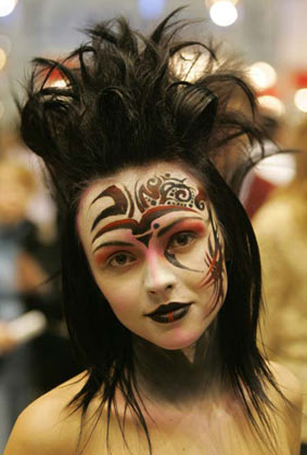 A model gets ready for the Tenth Moscow Championship of Hairdressers and Nail Art Designers in central Moscow, January 26, 2007. Over 300 artists are competing in the show, till the finals on Saturday. 