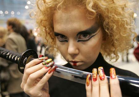 A model gets ready for the Tenth Moscow Championship of Hairdressers and Nail Art Designers in central Moscow, January 26, 2007. Over 300 artists are competing in the show, till the finals on Saturday. 
