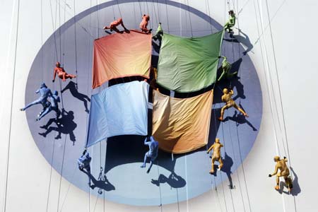 Sixteen aerialists perform on a giant billboard at the the launch of Windows Vista and Microsoft Office in New York January 29, 2007. The performance featured an original score from the new Windows Vista soundtrack.