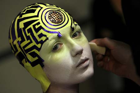 A model has make-up applied before Manish Arora's Autumn/Winter 2007 show at London Fashion Week in London February 12, 2007. 