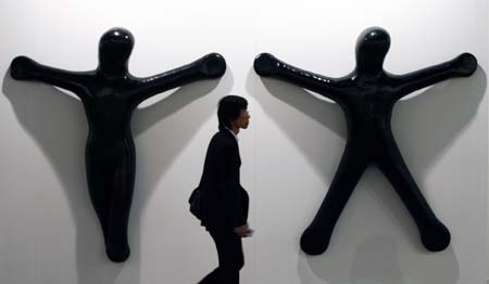 A visitor walks past an artwork at Madrid's international contemporary art fair ARCO February 14, 2007. This year's edition features the participation of 250 galleries from 30 countries with South Korea being this year's invited country. 