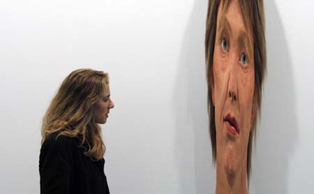 A visitor looks at an artwork at Madrid's international contemporary art fair ARCO February 14, 2007. This year's edition features the participation of 250 galleries from 30 countries with South Korea being this year's invited country. 