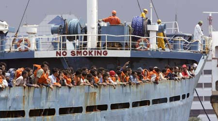 People arrive at the Jakarta Tanjung Priok port after being evacuated from a ferry that caught fire February 22, 2007. [Reuters]
