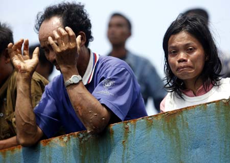 Survivors of a fire on a ferry arrive at the Tanjung Priok port in Jakarta February 22, 2007. 