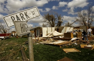 A street sign in the small town of Holly, Colo., is seen in the aftermath of a tornado, Thursday, March 29, 2007. A tornado as wide as two football fields carved a destructive path through this small southeastern Colorado town, killing one person, injuring at least seven others and leaving dozens of cattle dead or dying, authorities said Thursday. 