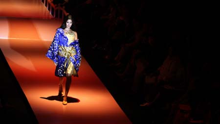 Bollywood actress Katrina Kaif displays an outfit by Indian designer Narendra Kumar during the grand finale of the India fashion week in Mumbai March 31, 2007. 