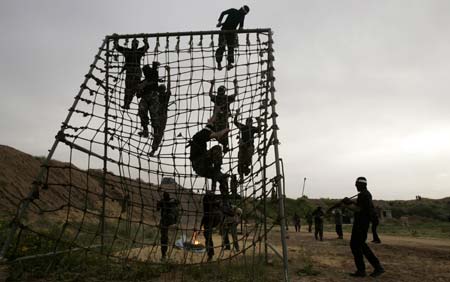 Palestinian Hamas militants take part in an armed exercise in Gaza March 31, 2007. European Union foreign ministers backed an Arab peace initiative on Saturday and agreed to engage with ministers of the new Palestinian national unity government who are not members of the Islamist Hamas movement. 