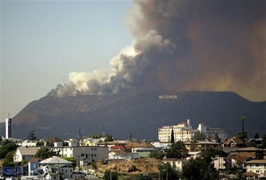 A wildfire burns in the Hollywood Hills area of Los Angels on Friday, March 30, 2007. The 24-acre fire started next to the Oakwood Toluca Hills, a corporate housing complex northwest of downtown, and spread up the north face of the hills. 