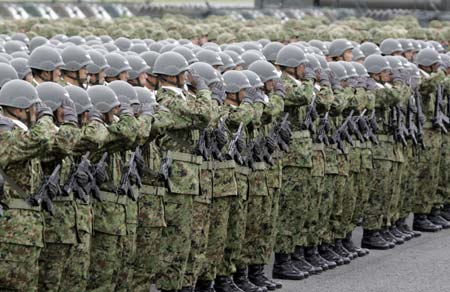Japan's Ground Self Defence Force (JGSDF) soldiers salute during a ceremony to mark the launch of Central Readiness Force at JGSDF's Asaka Base in Asaka, north of Tokyo March 31, 2007. 