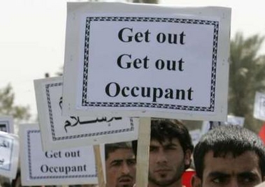Demonstrators chant slogans during a peaceful rally marking the fourth anniversary of the fall of Baghdad to invading American troops, in Najaf, April 9, 2007. Tens of thousands of people, responding to a call by powerful anti-American cleric Moqtada al-Sadr, waved Iraqi flags as they staged a peaceful rally in the southern city of Najaf on Monday to demand the withdrawal of U.S. forces.