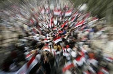 Demonstrators hold Iraqi flags during an anti-U.S. protest called by fiery cleric Moqtada al-Sadr in Najaf, marking the fourth anniversary of the fall of Baghdad April 9, 2007. Baghdad was under curfew on Monday on the fourth anniversary of the fall of the capital to U.S. forces. 