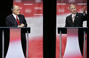 Republican presidential contenders Rudy Giuliani, former New York City mayor, listens as candidate Rep. Tom Tancredo, R-Co., answers a question during the first republican presidential primary debate of the 2008 election at the Ronald Reagan Library on Thursday, May 3, 2007 in Simi Valley, Calif. 
