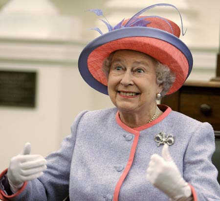 Britain's Queen Elizabeth II smiles during a visit with a group of local school children inside the old Senate chamber of the Virginia state capitol building on the first day of her trip to the United States in Richmond, Virginia, May 3, 2007. 