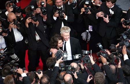 U.S. director David Lynch and actress Emily Stofle arrive for an evening gala screening of Chinese director Wong Kar Wai's in-competition film