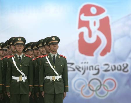 Paramilitary policemen take part in an exercise in preparation of the 2008 Beijing Olympics at an army base in Beijing May 16, 2007. 