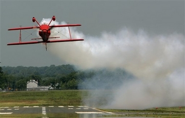 Aerobatic pilot Sean D. Tucker, flies his stunt plane upside-down during a demo run out of Manassas, Va., on Wednesday, May 16, 2007. Tucker will be flying his custom built Oracle Challenger III bi-plane at the Andrews Air Force Base Joint Service Open House and Air Show in Camp Springs, Md., that runs from this Friday to Sunday.