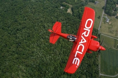 Aerobatic pilot Sean D. Tucker, enjoys his stunt plane during a demo run out of Manassas, Va., on Wednesday, May 16, 2007. Tucker will be flying his custom built Oracle Challenger III bi-plane at the Andrews Air Force Base Joint Service Open House and Air Show in Camp Springs, Md., that runs from this Friday to Sunday.