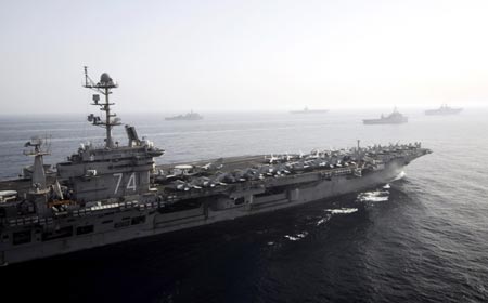 U.S. warships carrying 17,000 personnel enter the Gulf in a show of force off Iran's coast that navy officials said was the largest daytime assembly of ships since the 2003 Iraq war, in this handout photograph taken May 22, 2007. U.S. Navy officials said Iran was not notified of plans to sail nine ships, including two aircraft carriers, through the Straits of Hormuz, a narrow channel in international waters off Iran's coast and a major artery for global oil shipments. Picture taken May 22, 2007.