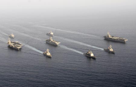 U.S. warships carrying 17,000 personnel enter the Gulf in a show of force off Iran's coast that navy officials said was the largest daytime assembly of ships since the 2003 Iraq war, in this handout photograph taken May 22, 2007. U.S. Navy officials said Iran was not notified of plans to sail nine ships, including two aircraft carriers, through the Straits of Hormuz, a narrow channel in international waters off Iran's coast and a major artery for global oil shipments. Picture taken May 22, 2007.