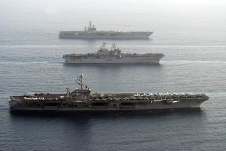 U.S. warships carrying 17,000 personnel enter the Gulf in a show of force off Iran's coast that navy officials said was the largest daytime assembly of ships since the 2003 Iraq war, in this handout photograph taken May 22, 2007. U.S. Navy officials said Iran was not notified of plans to sail nine ships, including two aircraft carriers, through the Straits of Hormuz, a narrow channel in international waters off Iran's coast and a major artery for global oil shipments. Picture taken May 22, 2007.
