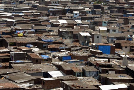 Dharavi, Asia's largest slum area, in Mumbai May 30, 2007. Authorities in India's financial capital invited a global tender on Wednesday to tear down Asia's biggest slum and replace it with gleaming new apartments, but the project is suspect in the eyes of most of it inhabitants. 
