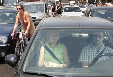 A cyclist ride naked through central Madrid, Saturday, June 9, 2007. Cyclists demonstrate to promote the use of bicycles and to highlight the danger due to lack of cycling lanes in the capital. 