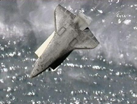 The Space Shuttle Atlantis perfoms a back-flip maneuver that will allow the Expedition 15 crew to photograph the shuttle's protective heat-resistant tiles in this view from NASA TV June 10, 2007. The imagery will be sent to engineers on Earth for analysis.