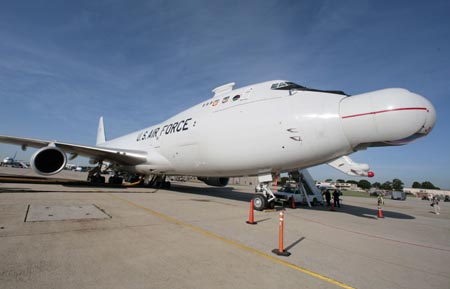 The U.S.A.F. Airborne Laser aircraft sits on the tarmac at Andrews Air Force Base outside Washington June 21, 2007. The modified 747 aircraft uses a high-energy Chemical Oxygen Iodine Laser to generate an energy beam from the aircraft's nose to intercept and destroy a hostile ballistic missile during the boost phase of its trajectory. 
