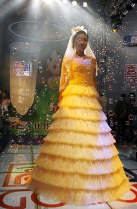 A model parades an outfit made of condoms during a fashion show at the 4th China Reproductive Health New Technologies & Products Expo in Beijing July 11, 2007. Condoms of all shapes and sizes were on show at a Beijing fashion show on Wednesday featuring dresses, hats and even lollipops made of the said item. 