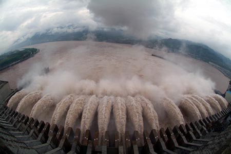 Flood water is discharged through the sluice on the Three Gorges Dam July 22, 2007. The Three Gorges reservoir on Friday saw its highest flood peak this year, but with no disruption of operations, Xinhua reported. [newsphoto] 