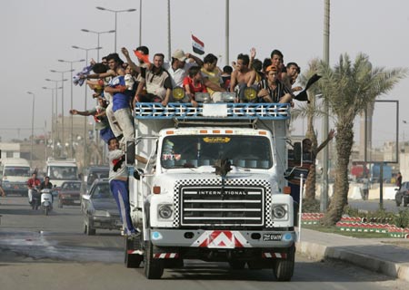 Residents ride a truck as they celebrate the victory of Iraq's soccer team over South Korea during the semi-final of the 2007 AFC Asian Cup soccer tournament, in Baghdad July 25, 2007.