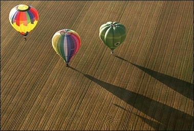 Hot air-balloons fly over a field near the Chambley-Bussieres air base, eastern France, during the 