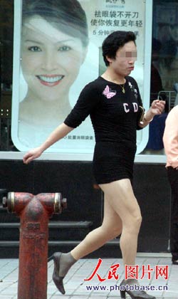 Man in high heels and miniskirt