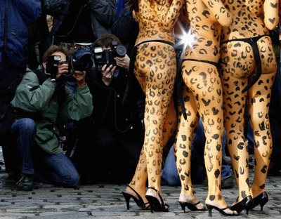 Animal rights advocates painted with Leopard spots