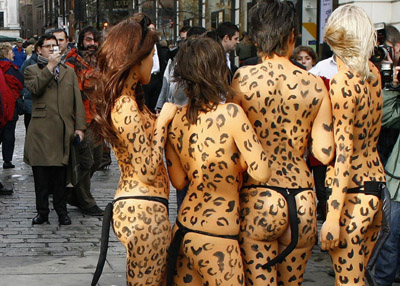 Animal rights advocates painted with Leopard spots