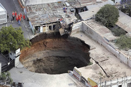 Giant hole swallows homes in Guatemala